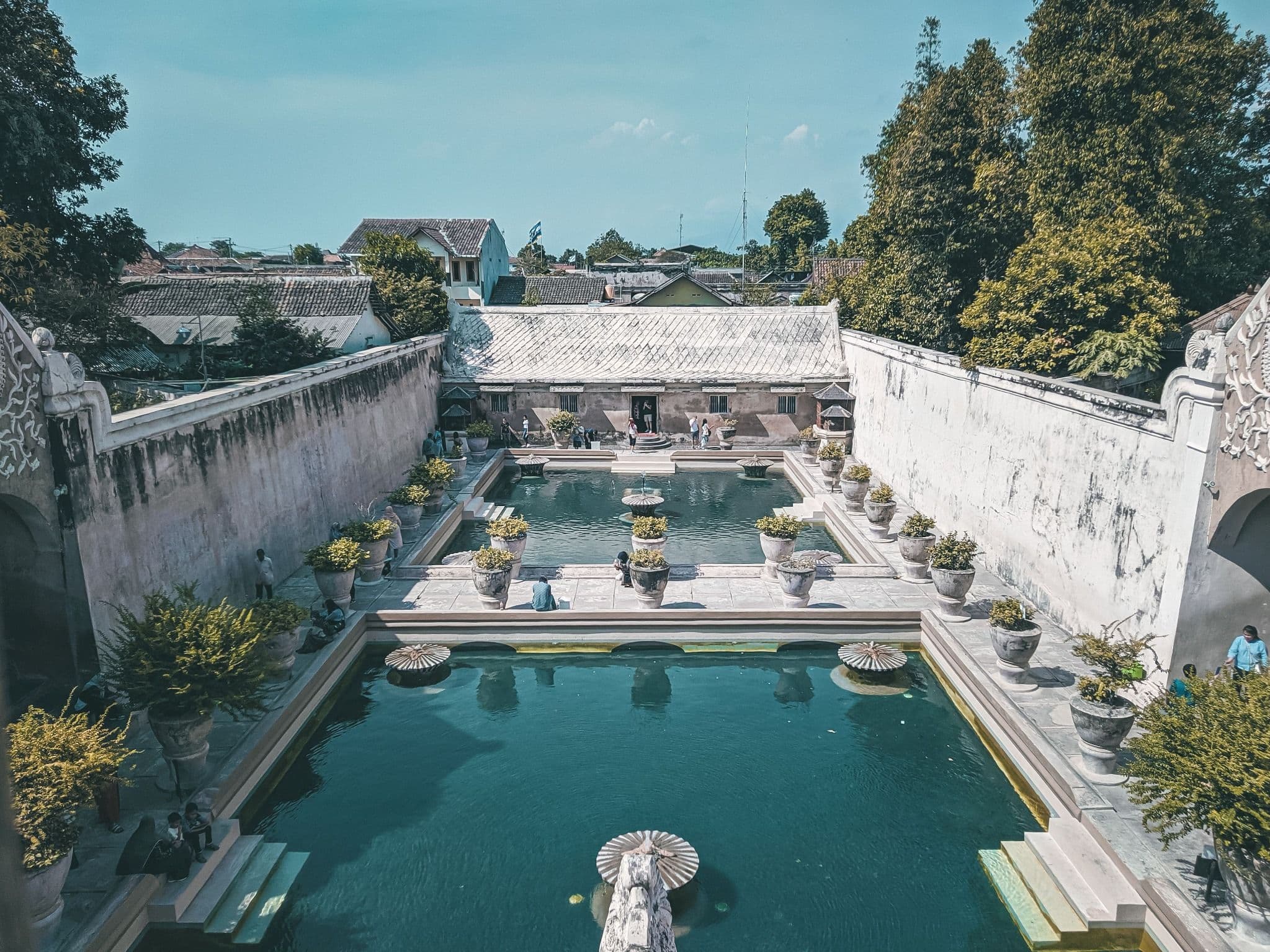 Historic bathing pools and white stone walls at Taman Sari in Yogyakarta.